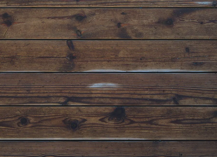 Detailed view of brown wooden planks showing rich texture and patterns.