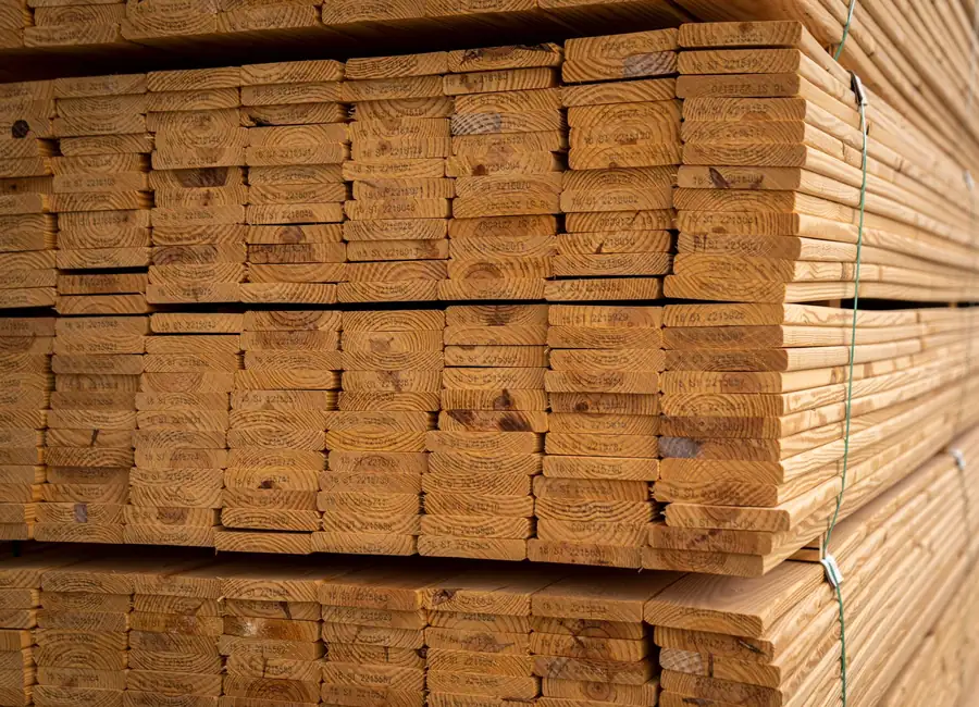 Close-up of stacked wooden planks, perfect for construction, showcasing natural wood textures.